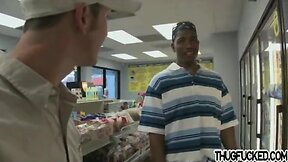 Black thug sucks white cock in a store